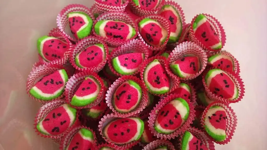 Colorful Malaysian watermelon-shaped cookies arranged on plate