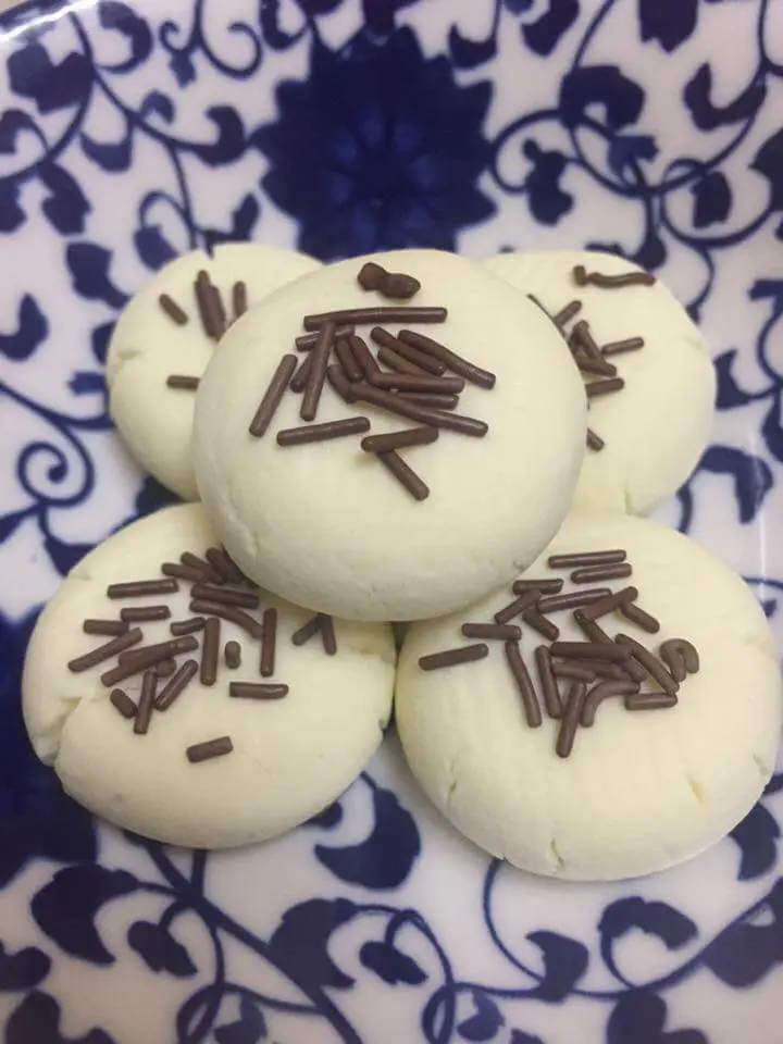 Golden brown Suji biscuits arranged on plate - Malaysian 3 ingredient cookies