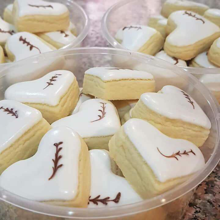 Traditional Malaysian Mama Carey cookies with white icing and chocolate decoration