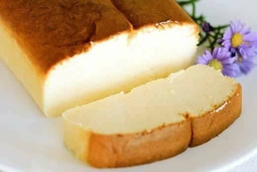 Moist viral cheese cake with golden brown top sliced and served